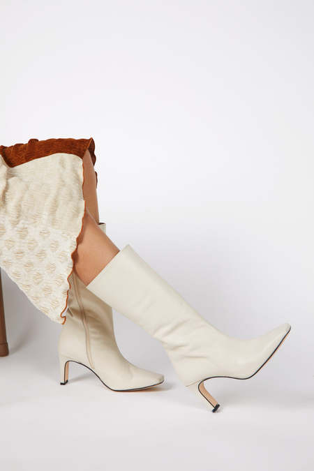 "INTENTIONALLY __________." Trot Heeled Boot - Clouds